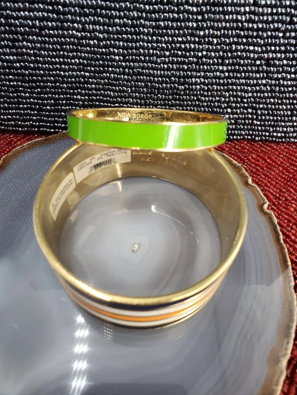 Two vibrant enamel and gold-plated bangle bracelets from Kate Spade New York. - Picture 4 of 17